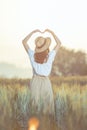 Beautiful asian woman having fun at barley field in summer at sunset time Royalty Free Stock Photo