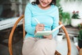 Beautiful asian woman at home writing and working with diary Royalty Free Stock Photo