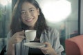 Beautiful asian woman and hot coffee cup happiness smiling face Royalty Free Stock Photo