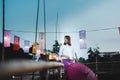 Beautiful Asian woman in local dress holding umbrella standi