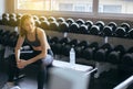 Beautiful asian female looking something and relax after the training session,Young teen taking a break after exercise and workout