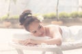 Beautiful asian woman lying with happy mood on vacation day.Wellness body care and spa aromatheraphy concept