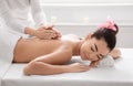Beautiful Asian Woman Lying On Spa Bed, Getting Back Massage Treatment Royalty Free Stock Photo