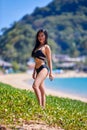 Beautiful asian woman posing on a tropical beach Royalty Free Stock Photo