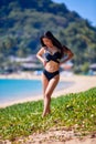 Beautiful asian woman posing on a tropical beach Royalty Free Stock Photo