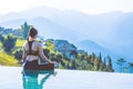 Woman practice yoga on the pool above the Mountain peak Royalty Free Stock Photo