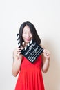 Beautiful asian woman red dress with movie clapper board on whit Royalty Free Stock Photo