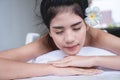 Beautiful Asian woman relaxing with hand massage treatment at be Royalty Free Stock Photo