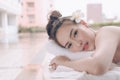 Beautiful Asian woman relaxing with hand massage treatment at be Royalty Free Stock Photo