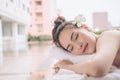 Beautiful Asian woman relaxing with hand massage treatment at be Royalty Free Stock Photo