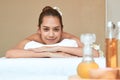 Beautiful Asian woman Relaxing On Massage Table and Smiling Royalty Free Stock Photo