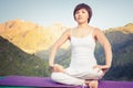 Beautiful asian woman relaxing and meditating outdoor at mountain Royalty Free Stock Photo