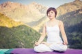 Beautiful asian woman relaxing and meditating outdoor at mountain Royalty Free Stock Photo