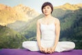 Beautiful asian woman relaxing and meditating outdoor at mountain Royalty Free Stock Photo