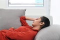 Beautiful asian woman sleeping on a couch Royalty Free Stock Photo