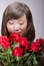 Beautiful Asian Woman Smelling Flowers