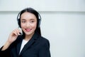 Beautiful asian woman smiling customer service talking on headset. Royalty Free Stock Photo