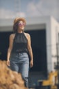 beautiful asian woman smiling with hapiness face standing outdoor against building construction site