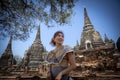 beautiful asian woman smiling with happiness face standing in ancient heritage site of unesco ayutthaya thailand