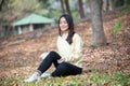 Beautiful Asian woman Smiling happy girl and wearing warm clothes winter and autumn portrait at outdoor in park Royalty Free Stock Photo