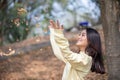 Beautiful Asian woman Smiling happy girl and wearing warm clothes winter and autumn portrait at outdoor in park Royalty Free Stock Photo