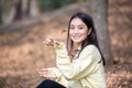 Beautiful Asian woman Smiling happy girl and wearing warm clothes winter and autumn portrait at outdoor in park Royalty Free Stock Photo
