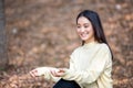 Beautiful Asian woman Smiling happy girl and wearing warm clothes winter and autumn portrait at outdoor in park Royalty Free Stock Photo