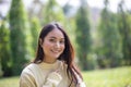 Beautiful Asian woman Smiling happy girl and wearing warm clothes winter and autumn portrait at outdoor in park Royalty Free Stock Photo