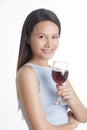 Beautiful Asian woman smiling and holding glass of red wine Royalty Free Stock Photo