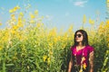 Asian Woman standing in sunhemp field at countryside Royalty Free Stock Photo