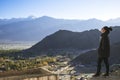 A beautiful Asian woman standing on the top of view point with Leh city background Royalty Free Stock Photo