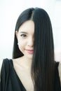 Beautiful Asian woman with straight healthy dark hair - haircare concept Royalty Free Stock Photo