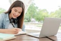 Beautiful Asian woman student excited check language test result on laptop. Smile girl happy study online. Portrait female on Royalty Free Stock Photo