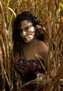 Girl in pensive pose amongst an Elephant Grass field Royalty Free Stock Photo