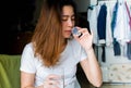 A beautiful asian woman is taking medicine and drinking water Royalty Free Stock Photo