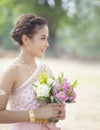 Beautiful asian woman toothy smiling face and pink lotus flower Royalty Free Stock Photo
