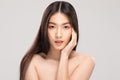 Beautiful Asian woman touching soft cheek smile with clean and fresh skin