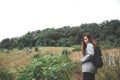 A beautiful Asian woman tourist walking and trekking along the mountains in tropical forest