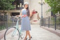 Beautiful asian woman travel by city vintage bicycle Royalty Free Stock Photo