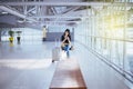 Beautiful Asian woman traveler using mobile phone in airport, Lifestyle using cell phone Royalty Free Stock Photo