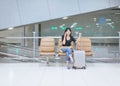 Beautiful Asian woman traveler using mobile phone in airport, Lifestyle using cell phone Royalty Free Stock Photo