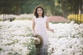Beautiful Asian woman in tropical flower garden Royalty Free Stock Photo