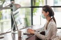 Beautiful asian woman wearing protection mask work from home in the morning. Young asian female working with computer stay at home Royalty Free Stock Photo