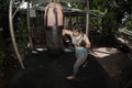 Beautiful Asian women are punching sandbags in the gym, exercise ideas, weight loss, muscle building and self defense. Royalty Free Stock Photo