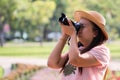 Beautiful Asian women with backpack aim camera in the jungle Royalty Free Stock Photo