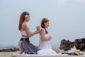 Beautiful asian woman enjoying spa massage therapy on the beach Royalty Free Stock Photo