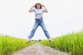 Beautiful asian women are happy and jumping in the rice field Royalty Free Stock Photo