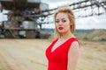 Beautiful asian women posing on excavator background