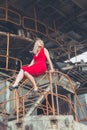 Beautiful asian women posing on excavator background