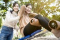 Beautiful asian woman practicing fitness,doing sit up exercise for health at city park,happy smiling female people doing abdominal Royalty Free Stock Photo